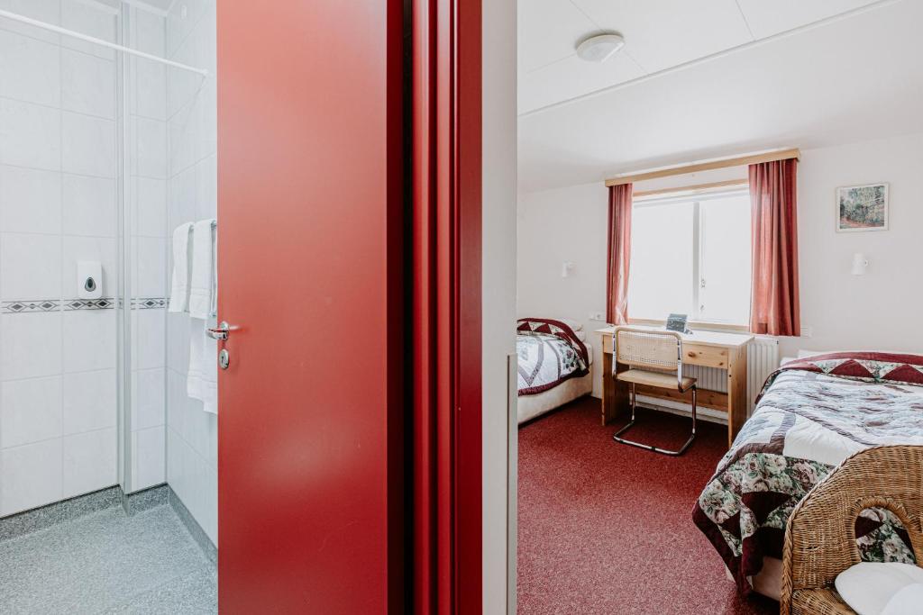 Postel nebo postele na pokoji v ubytování Narfastadir Guesthouse