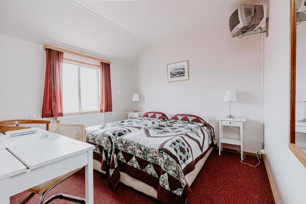 Postel nebo postele na pokoji v ubytování Narfastadir Guesthouse