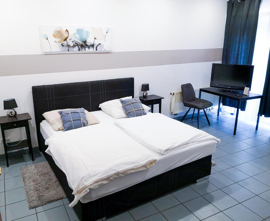 Postel nebo postele na pokoji v ubytování Hotel zur Schlemmerscheune