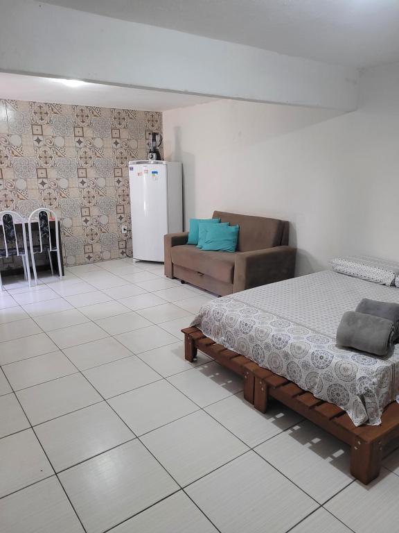 Een bed of bedden in een kamer bij Loft 1 Moradas Vila 57