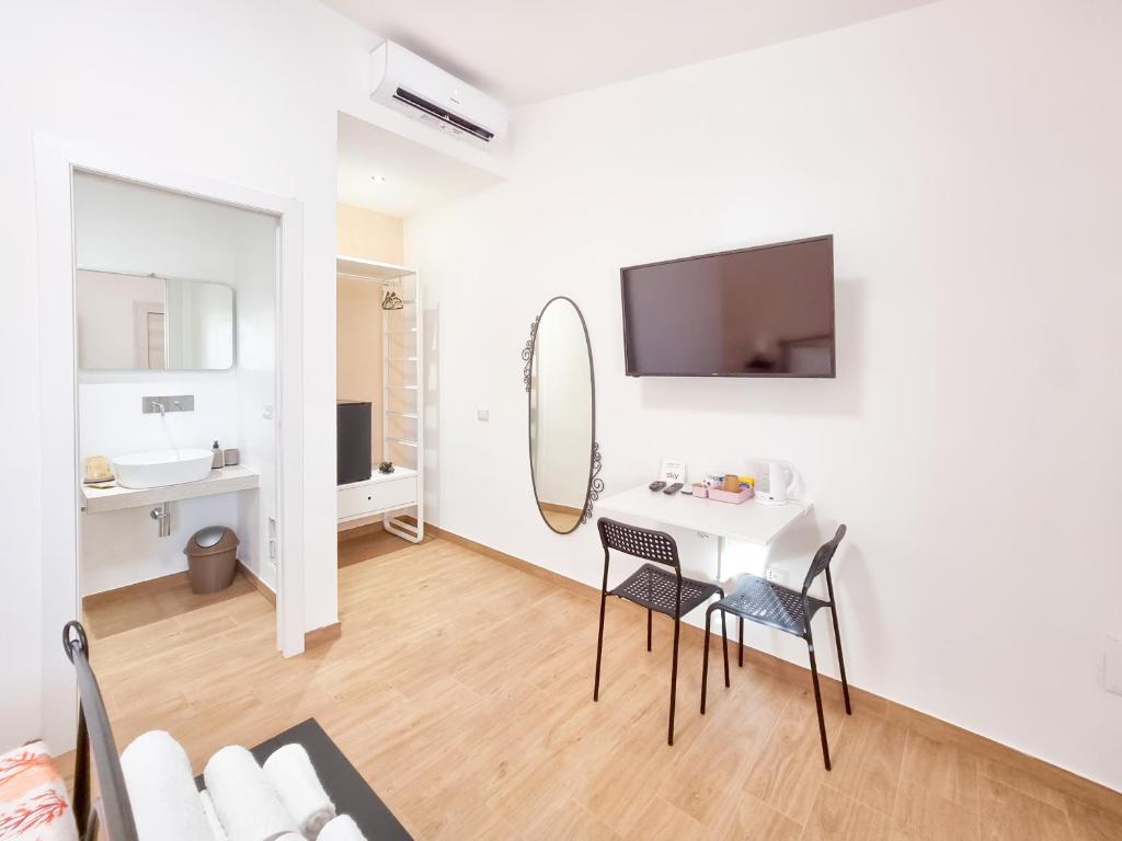 TV a/nebo společenská místnost v ubytování Agriturismo Sa Jana Holidays - Adults Only