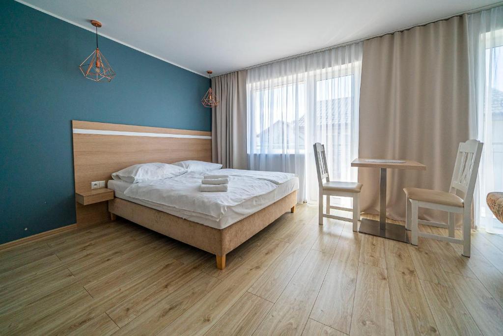 Postel nebo postele na pokoji v ubytování Willa Promyk