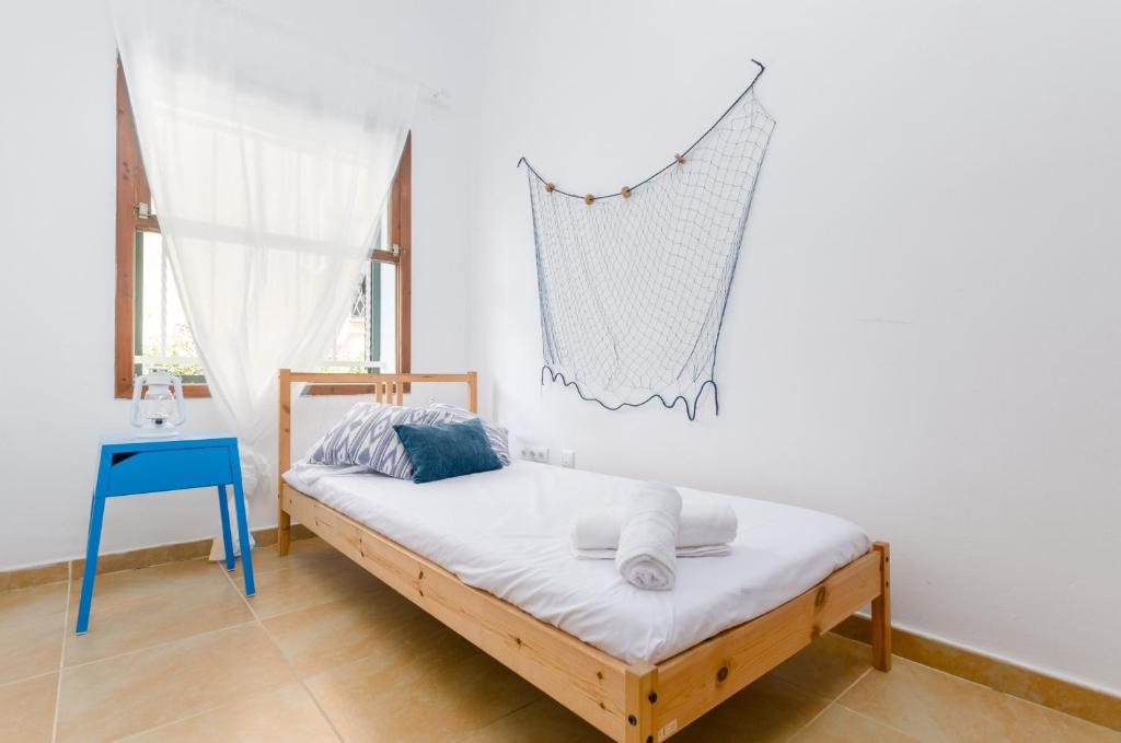 Postel nebo postele na pokoji v ubytování YourHouse Ca Na Salera villa
