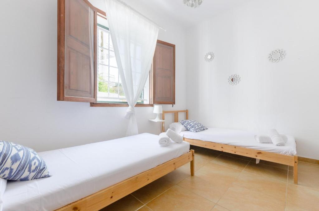 Postel nebo postele na pokoji v ubytování YourHouse Ca Na Salera villa