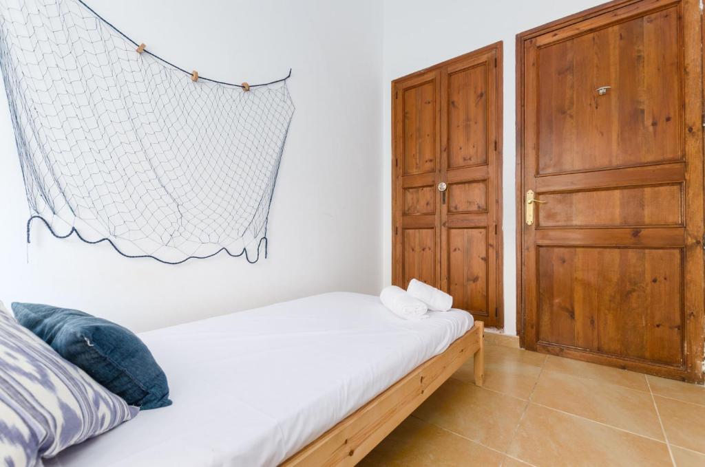 Postel nebo postele na pokoji v ubytování YourHouse Ca Na Salera villa