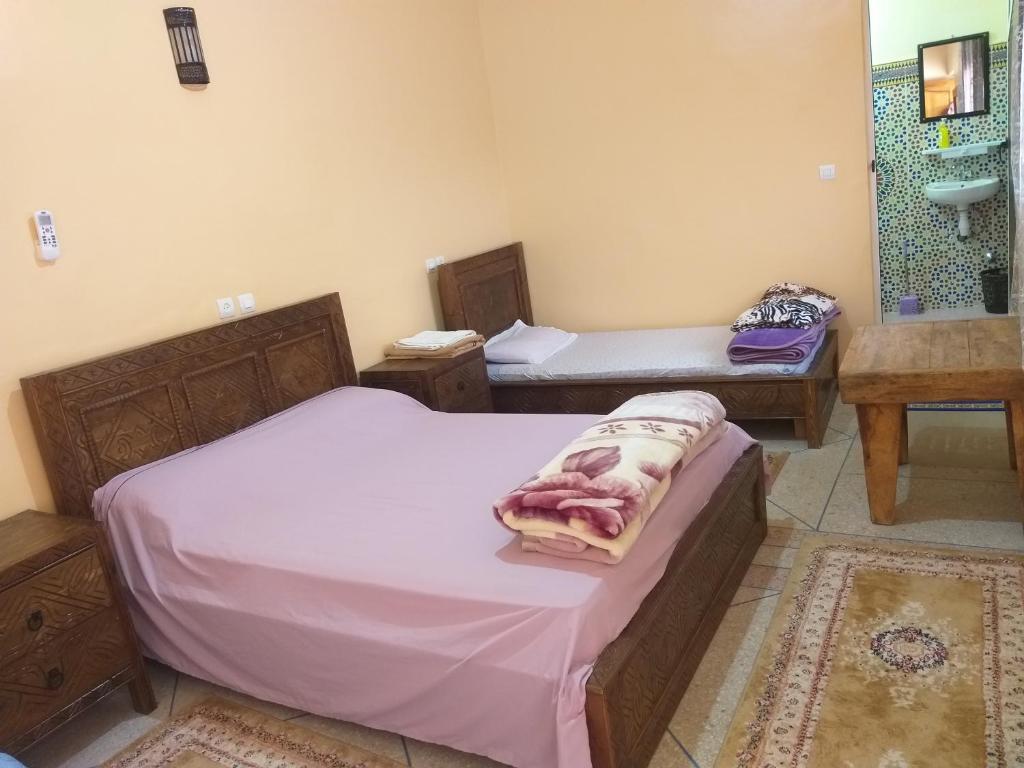 Postel nebo postele na pokoji v ubytování Oasis de Tiout