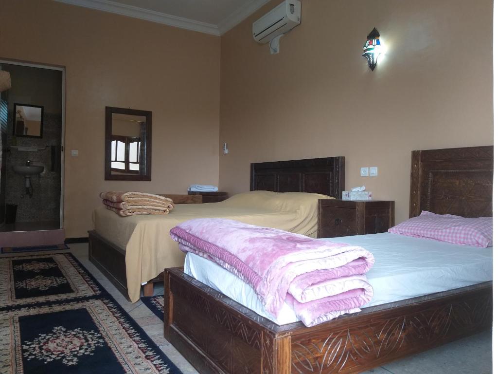 Postel nebo postele na pokoji v ubytování Oasis de Tiout