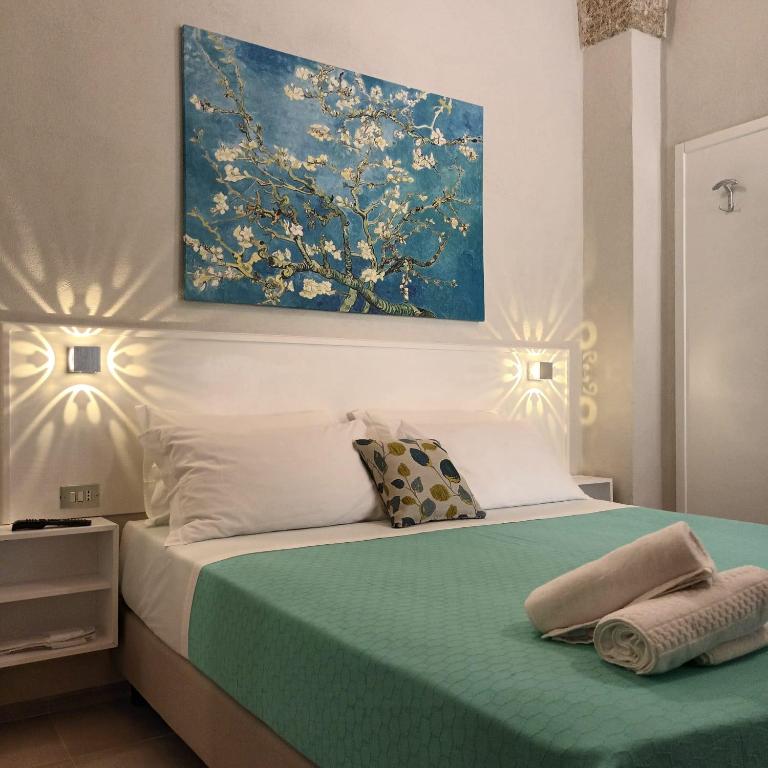 Postel nebo postele na pokoji v ubytování Dimora Mazzini - Salento Selection