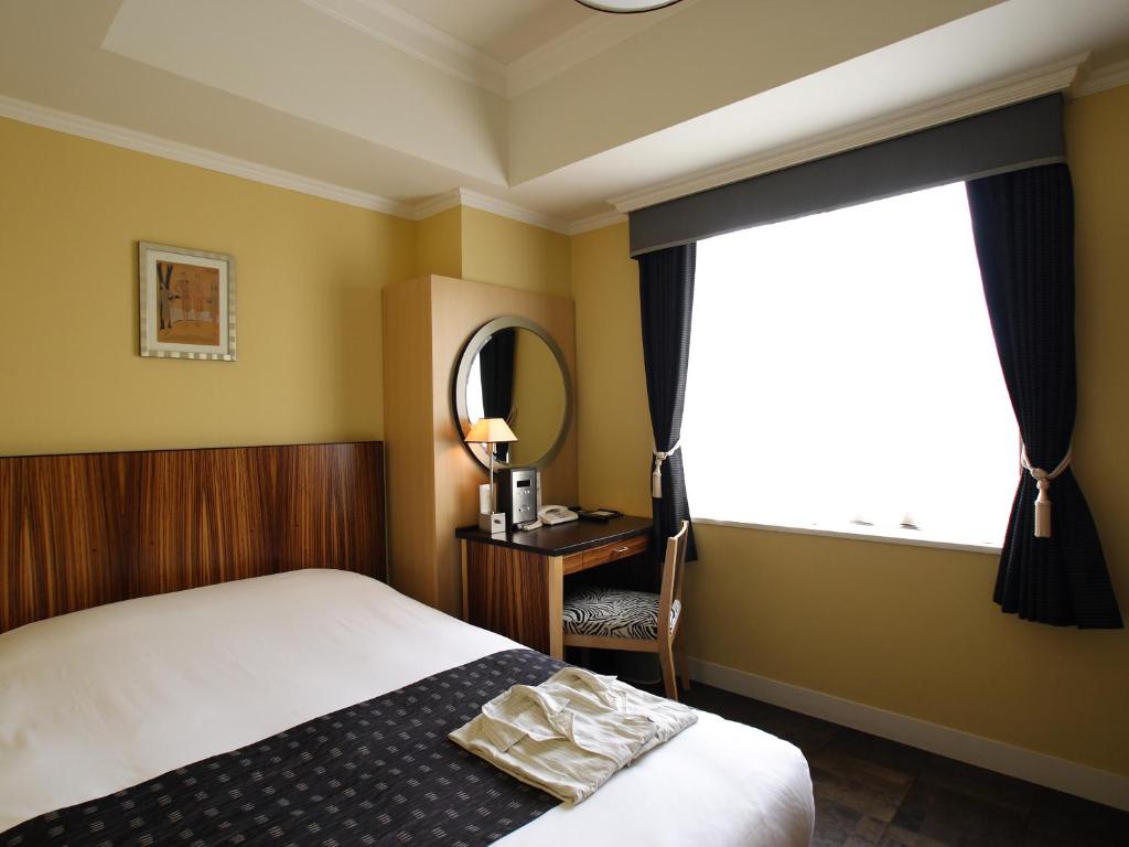 Cama ou camas em um quarto em Hotel Monterey La Soeur Fukuoka