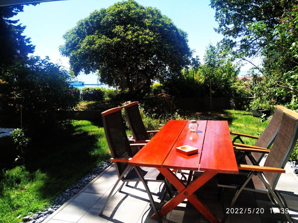 a red table and chairs on a patio at Marjan Rose in Split