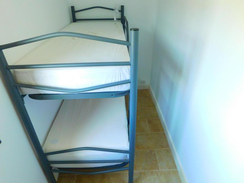 A bed or beds in a room at GMID IMMO Apartamento Punta Pelegrí