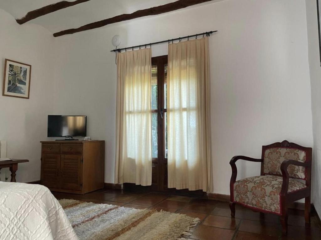 A television and/or entertainment centre at Casa Rural Catifalarga Alpujarra