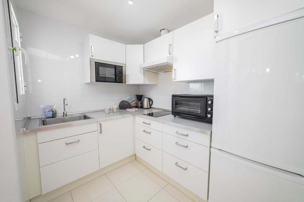 Kuchyň nebo kuchyňský kout v ubytování Apartamento Xara