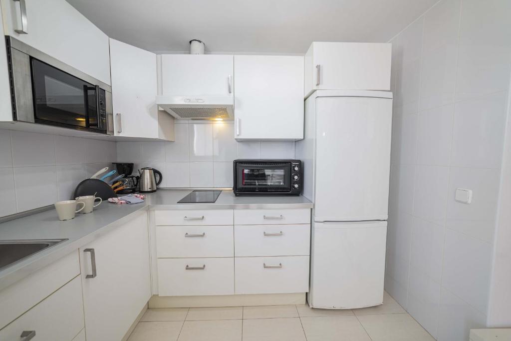 Kuchyň nebo kuchyňský kout v ubytování Apartamento Xara