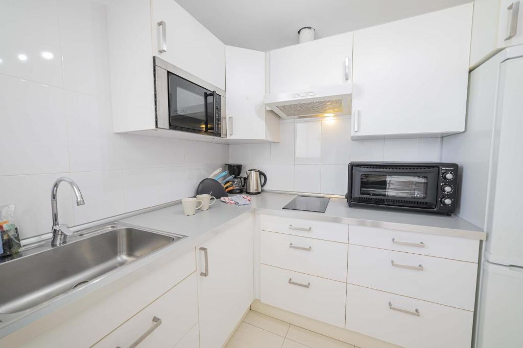 Kuchyň nebo kuchyňský kout v ubytování Apartamento Xara