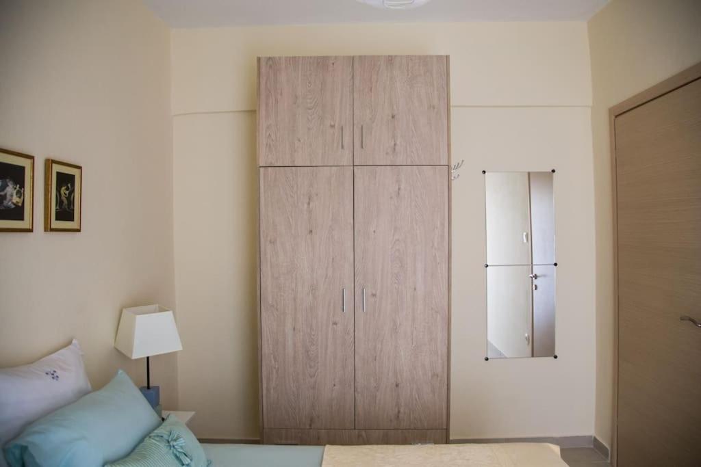 A bed or beds in a room at Blue Theros Apartments
