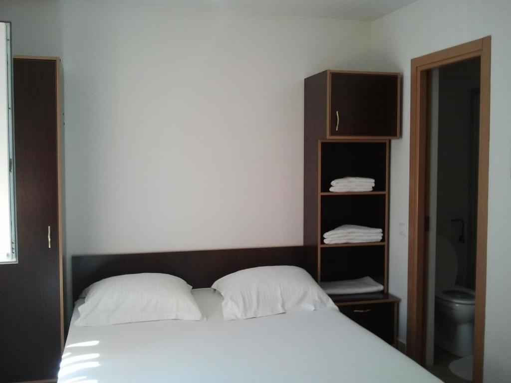 Postel nebo postele na pokoji v ubytování JR Motel