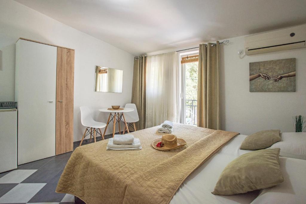 Postel nebo postele na pokoji v ubytování Apartments MaXhit