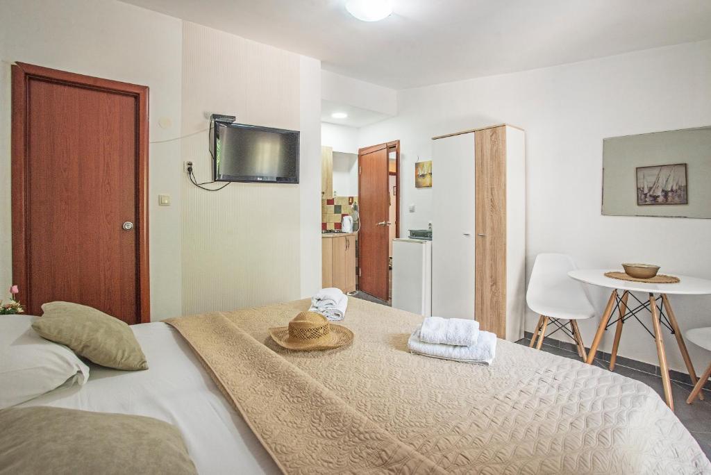 Postel nebo postele na pokoji v ubytování Apartments MaXhit