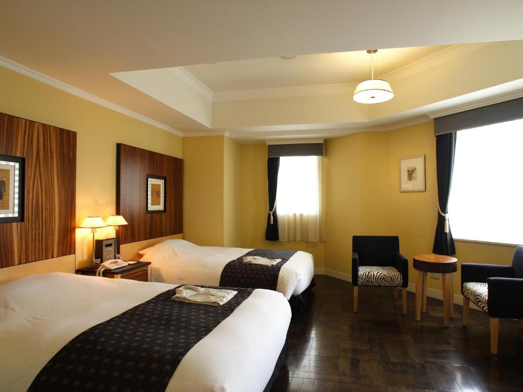 Cama ou camas em um quarto em Hotel Monterey La Soeur Fukuoka