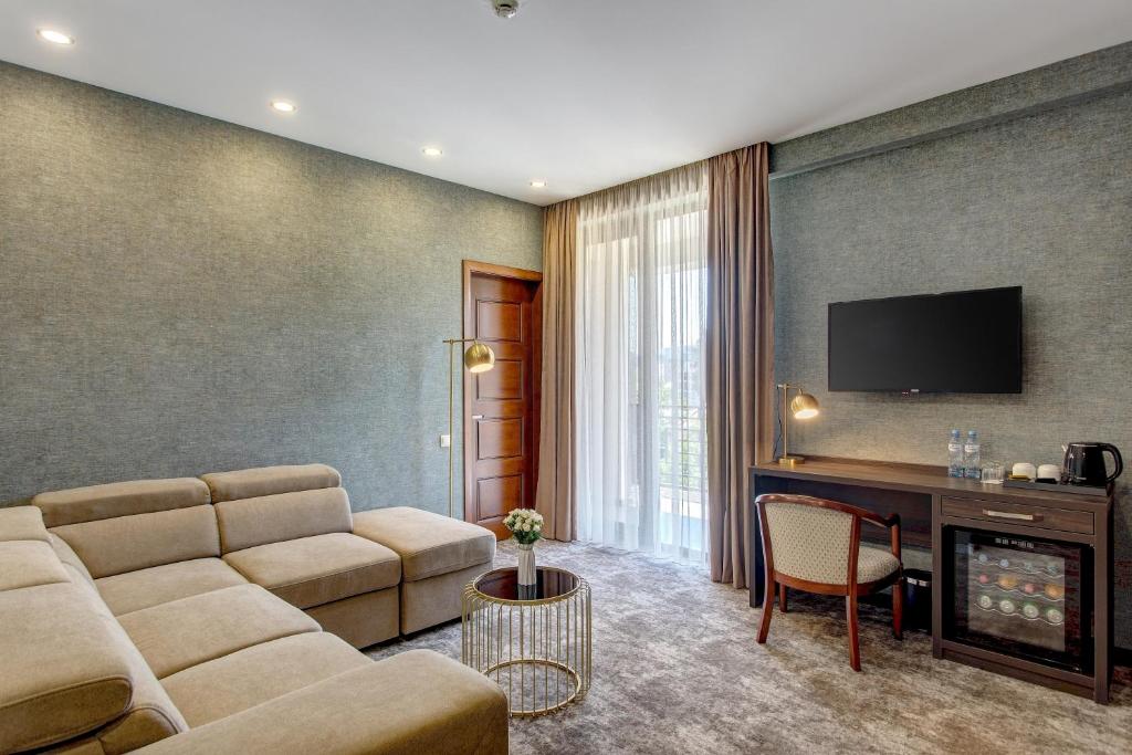 TV a/nebo společenská místnost v ubytování Vinum Hotel