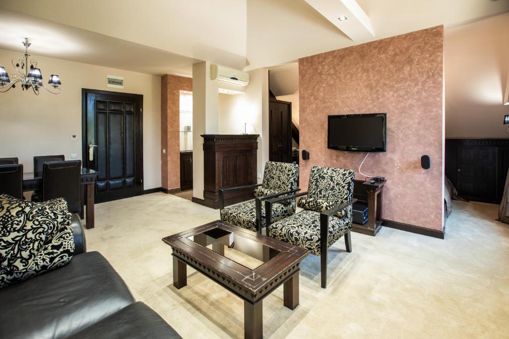 TV a/nebo společenská místnost v ubytování Hotel Vila Lago