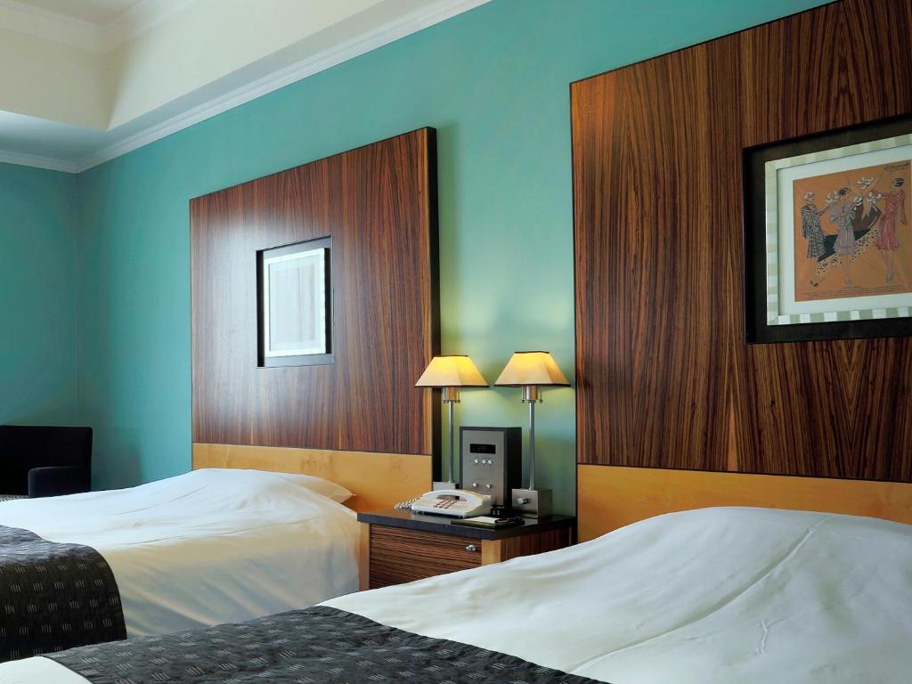 Cama ou camas em um quarto em Hotel Monterey La Soeur Fukuoka