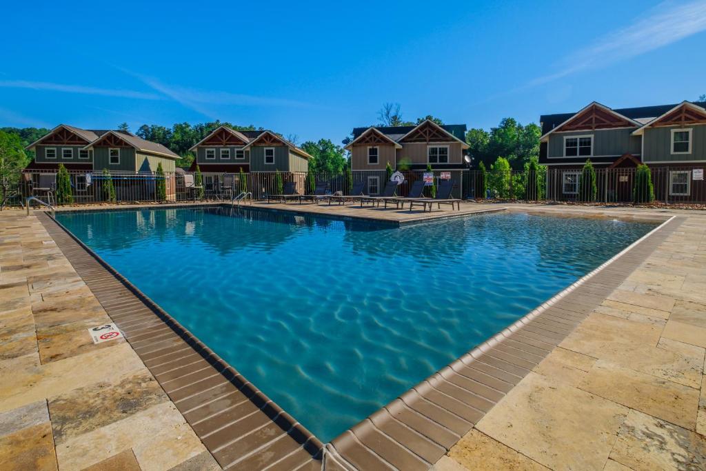 a swimming pool with blue water in a home at BearVue Point chalet in Gatlinburg