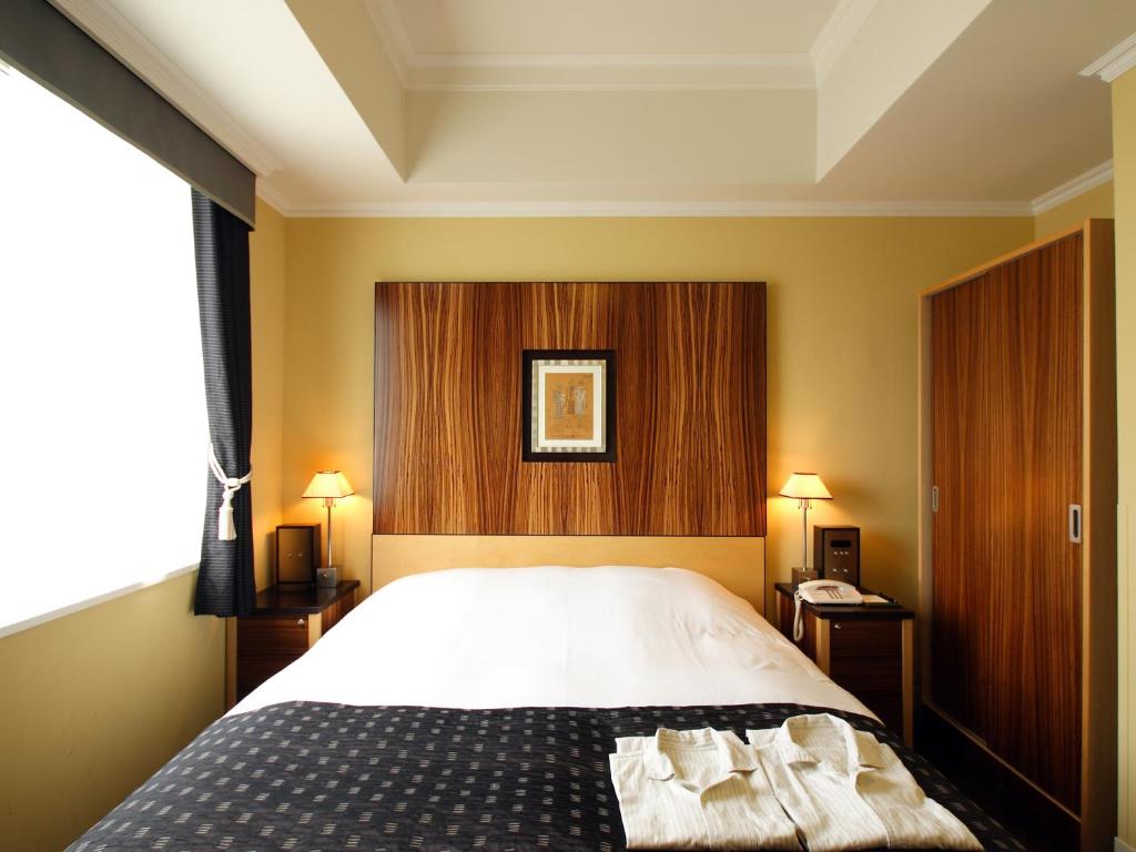 Cama ou camas em um quarto em Hotel Monterey La Soeur Fukuoka