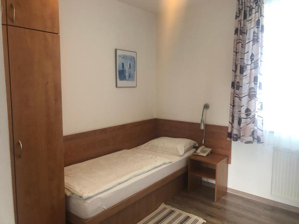 Postel nebo postele na pokoji v ubytování Hotel Mlyn