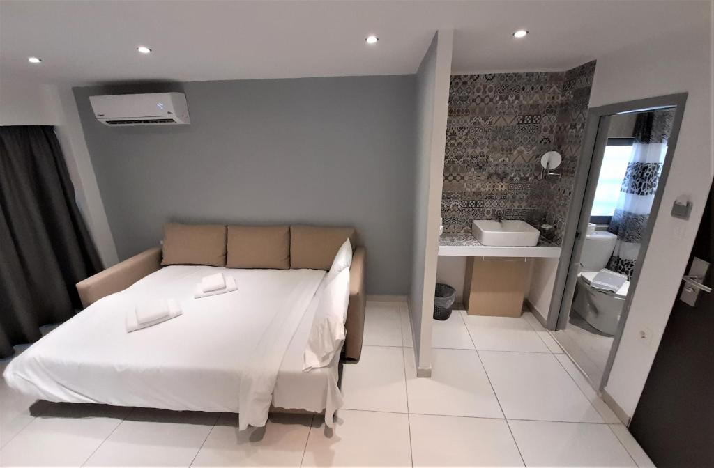 Postel nebo postele na pokoji v ubytování Elite Hotel