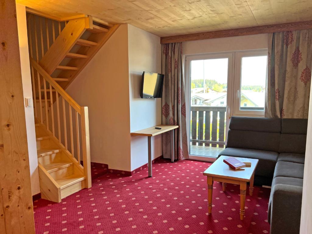 TV a/nebo společenská místnost v ubytování Hotel Quehenberger