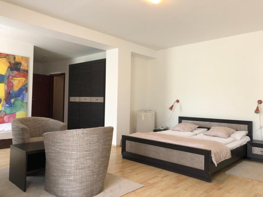 Postel nebo postele na pokoji v ubytování Hotel Mlyn