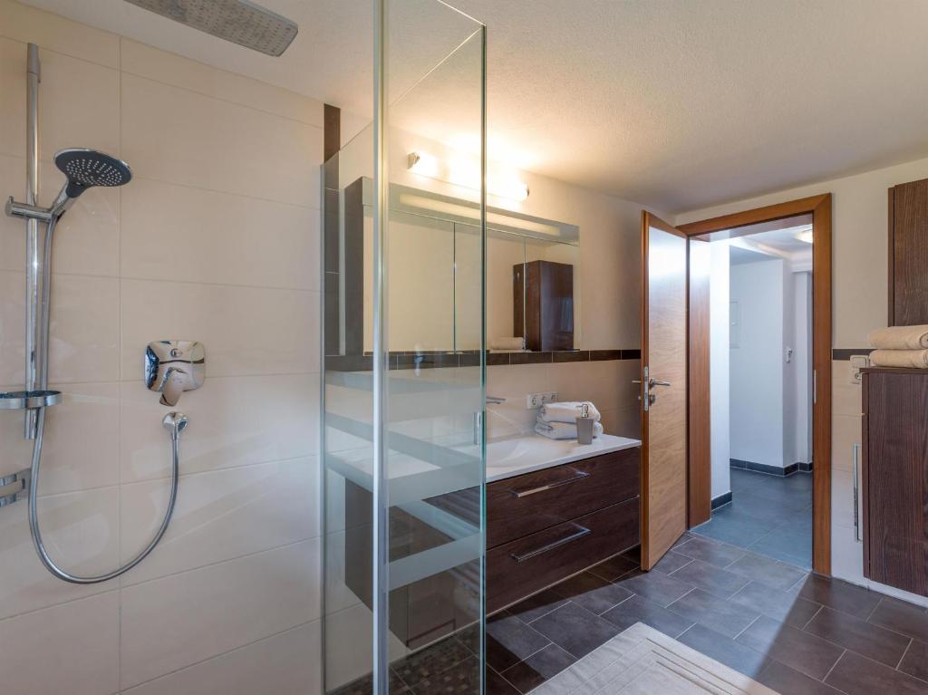 a bathroom with a shower and a sink at Appartement Waldmoos in Ellmau