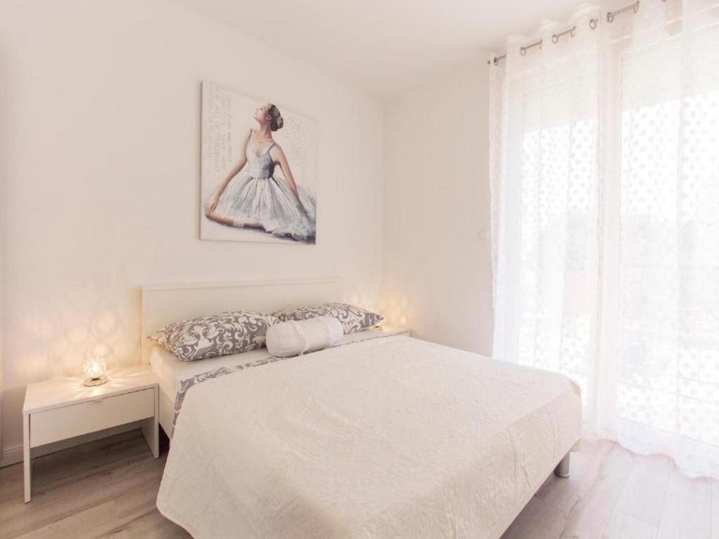 Posteľ alebo postele v izbe v ubytovaní Crystal Apartment