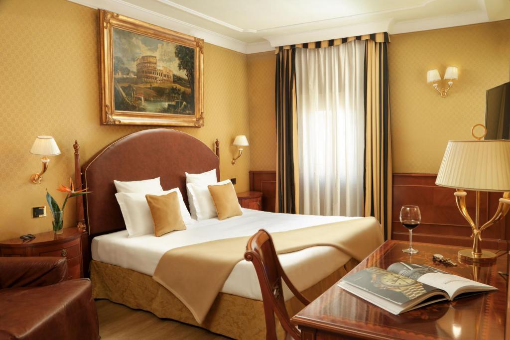 Postel nebo postele na pokoji v ubytování Hotel Homs
