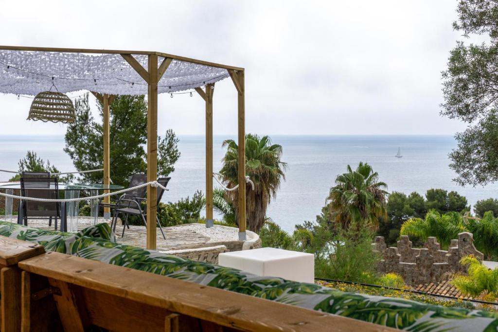 a view of the ocean from the deck of a house at CALA 51 - Villa with sea view in Blanes