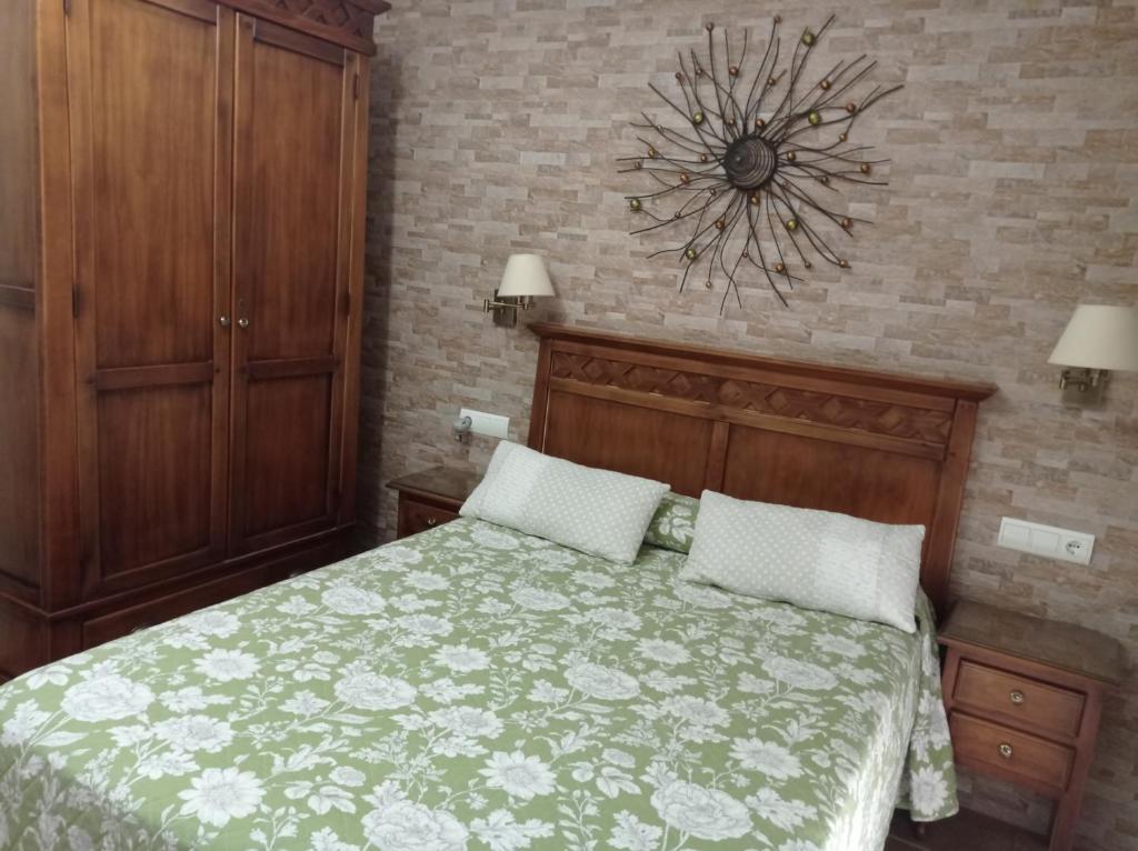Postel nebo postele na pokoji v ubytování Hostal Costa Luz