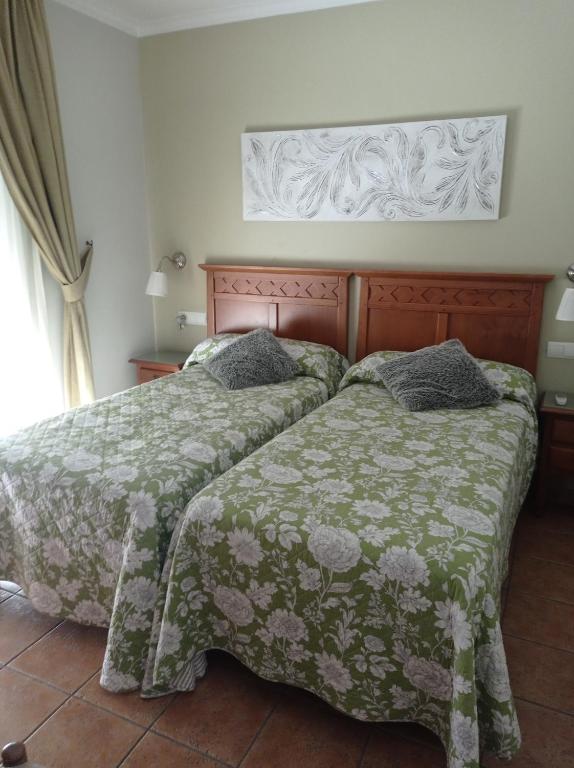 Ένα ή περισσότερα κρεβάτια σε δωμάτιο στο Hostal Costa Luz