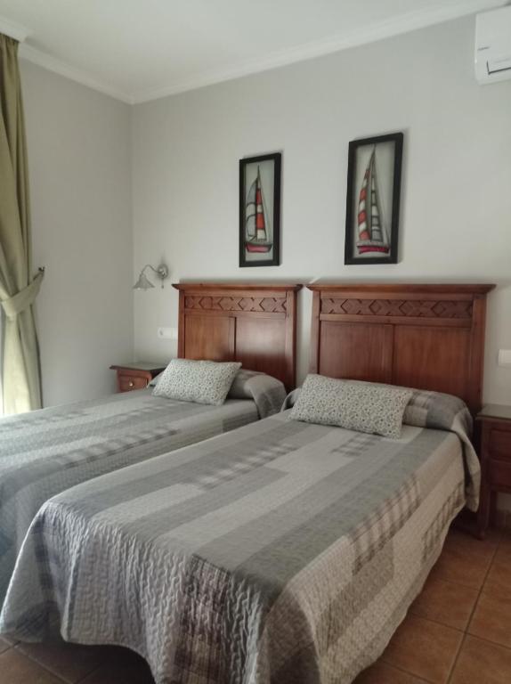 Postel nebo postele na pokoji v ubytování Hostal Costa Luz