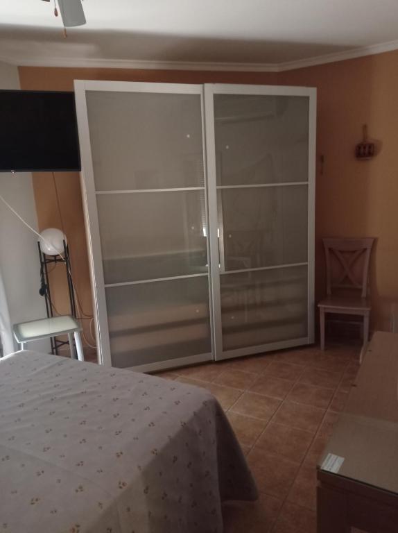 Postel nebo postele na pokoji v ubytování Hostal Costa Luz