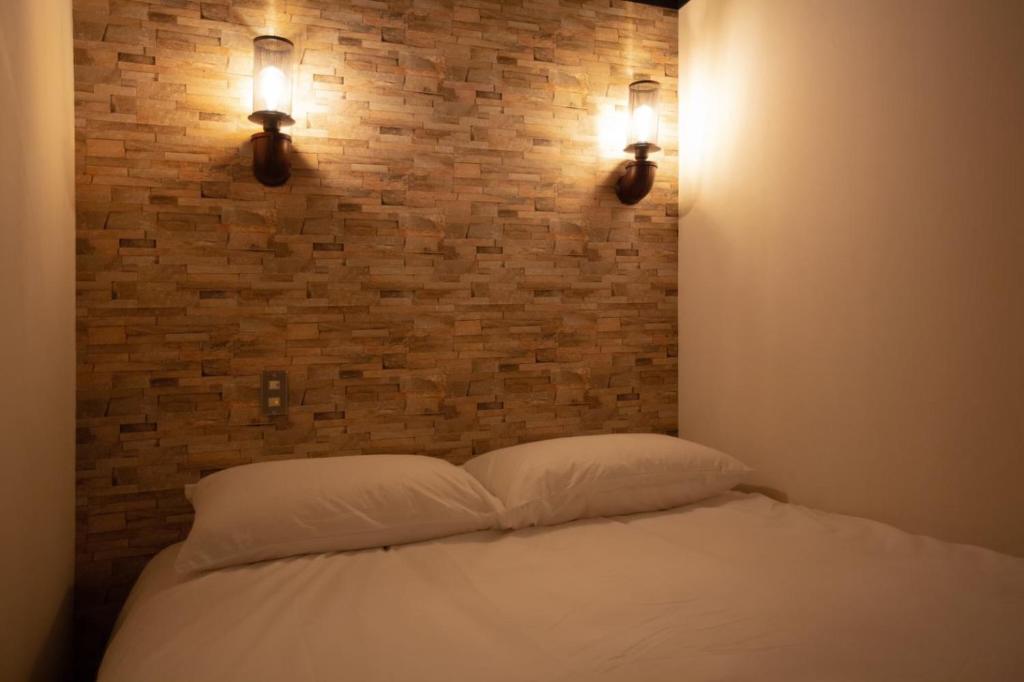 Postel nebo postele na pokoji v ubytování The Rooms Inn