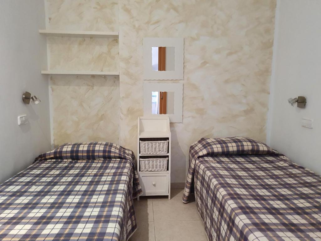 Postel nebo postele na pokoji v ubytování Apartaments Les Roques