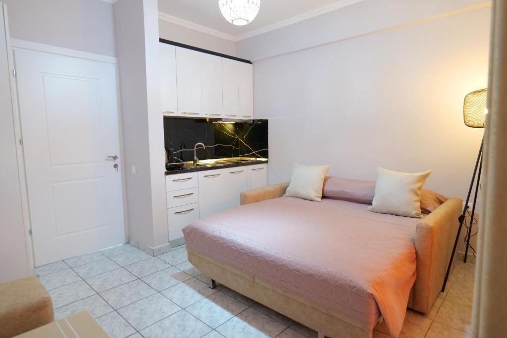 Postel nebo postele na pokoji v ubytování Kosta Apartments