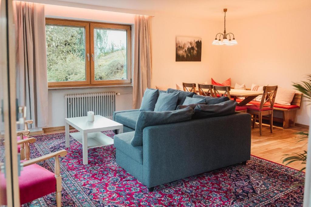 Area soggiorno di Ferienwohnung Waldgarten