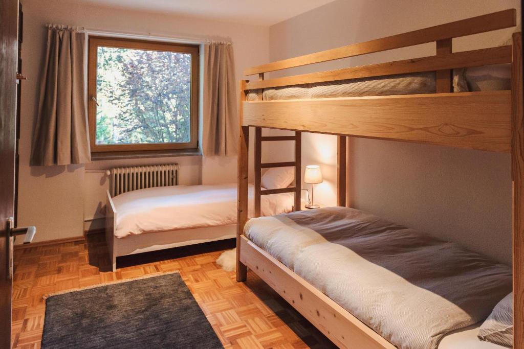 Letto o letti in una camera di Ferienwohnung Waldgarten