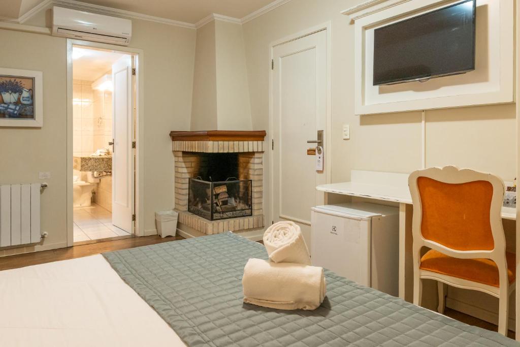 Postel nebo postele na pokoji v ubytování Hotel Monte Felice Bosque