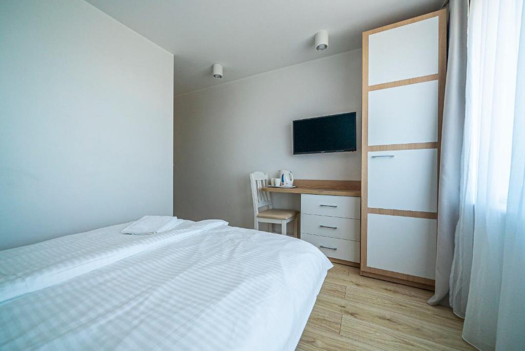 Postel nebo postele na pokoji v ubytování Willa Promyk