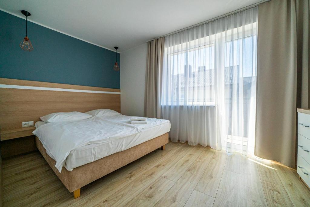 Postel nebo postele na pokoji v ubytování Willa Promyk