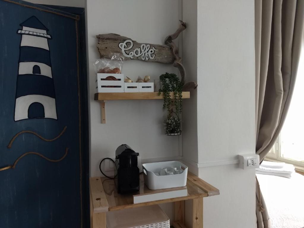 Ein Bett oder Betten in einem Zimmer der Unterkunft "Beach Cottage" monolocale vicino alla spiaggia